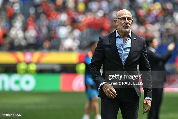Spain's head coach Luis de la Fuente celebrates after winning the 2026 World Cup football tournament quarter-final match between Spain and Belgium at...