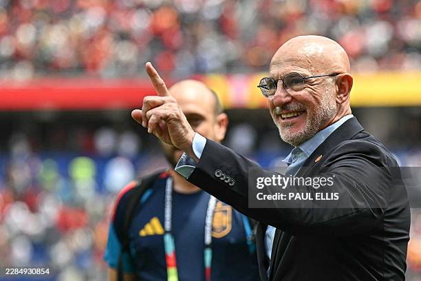 Spain's head coach Luis de la Fuente celebrates after winning the 2026 World Cup football tournament quarter-final match between Spain and Belgium at...