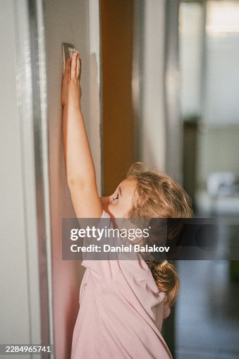 Child Reaching For Light Switch Developing Independence Child Reaching For Light Switch Developing Independence