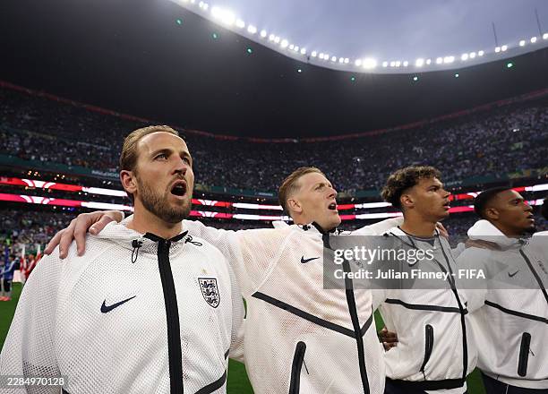 Harry Kane of England, Jordan Pickford of England and Nico O'Reilly of England sing the national anthem during the FIFA World Cup 2026 Round Of 16...