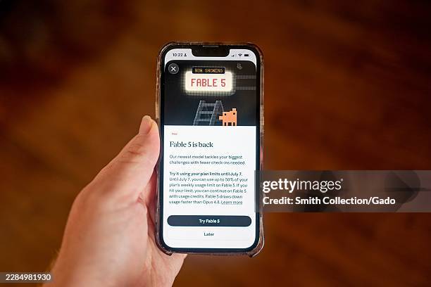Close-up of Claude artificial intelligence app on an iPhone, showing information about the return of the Fable 5 model from Anthropic, Lafayette,...