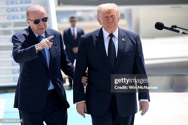 President, Donald Trump , is greeted by Turkish President, Recep Tayyip Erdogan, as he arrives at Etimesgut Air Base for the annual NATO Summit on...