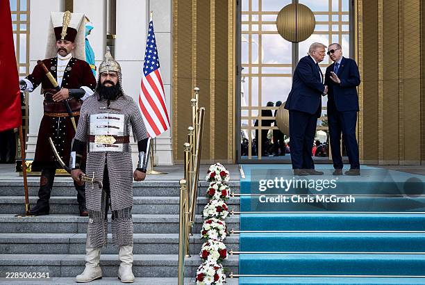 Turkish President Recep Tayyip Erdogan and U.S. President Donald Trump arrive during a state arrival ceremony at the Bestepe Presidential Complex for...