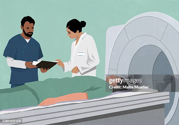 illustrazioni stock, clip art, cartoni animati e icone di tendenza di doctors discussing medical chart of patient laying at a cat scan machine - radiologo