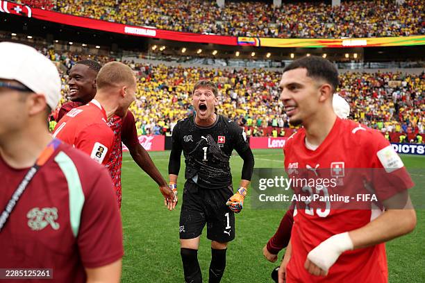 Gregor Kobel of Switzerland celebrates with teammates after the penalty shootout victory during the FIFA World Cup 2026 Round of 16 match between...