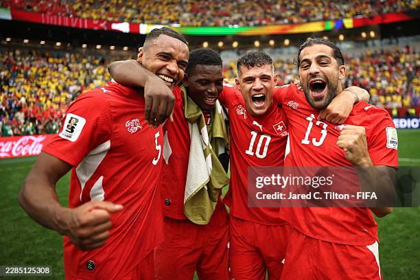 Manuel Akanji, Breel Embolo, Granit Xhaka and Ricardo Rodriguez of Switzerland celebrate after the penalty shootout victory during the FIFA World Cup...