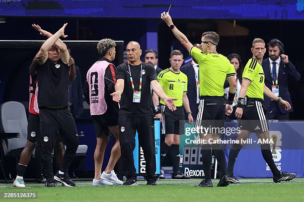 Hossam Hassan Manager / Head Coach of Egypt makes a cross arm gesture as Referee Francois Letexier shows a yellow card during the FIFA World Cup 2026...
