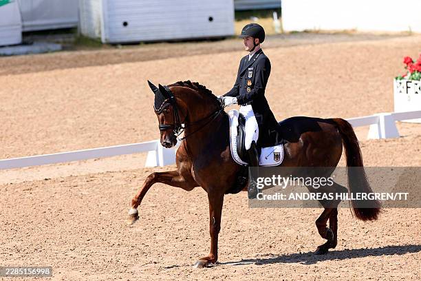 Moritz Treffinger from Germany rides the horse Fiderdance during the FEI Grand Prix Kür dressage competition at the Falsterbo horse show in...