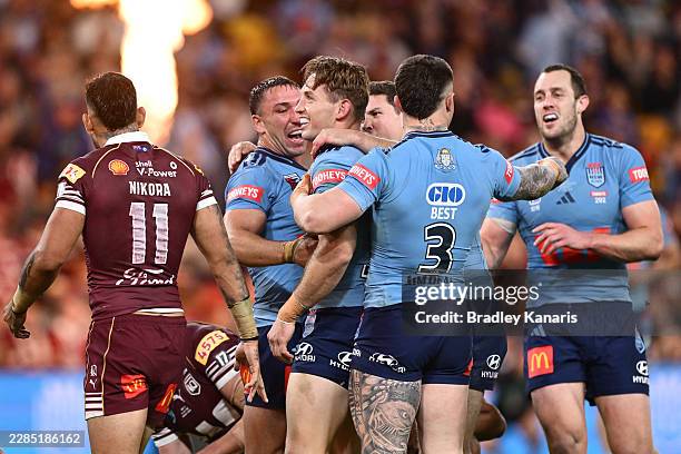 Cameron Murray of the Blues celebrates scoring his teams third try during game three of the Men's State of Origin series between the Queensland...