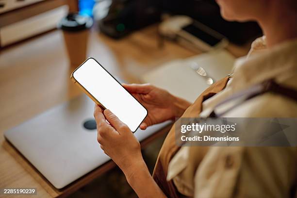 small business owner using smartphone blank screen - apron mockup stock pictures, royalty-free photos & images