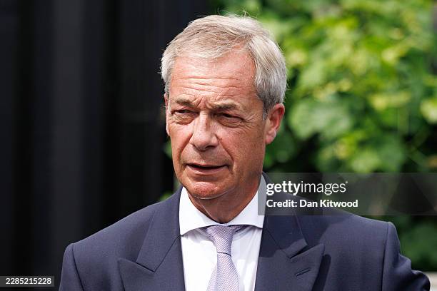 Reform UK leader Nigel Farage visits a pub on July 08, 2026 in Great Bentley, England. On Tuesday, Reform UK Leader Nigel Farage announced his...