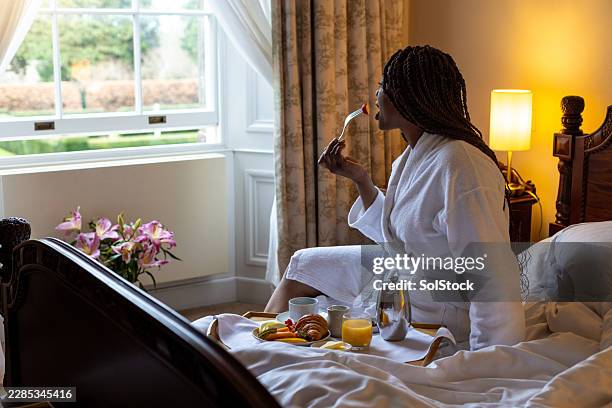 relaxing with breakfast in bed - staycation stock pictures, royalty-free photos & images