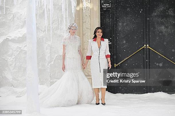 Designer Celia Kritharioti acknowledges the audience with a model during the Celia Kritharioti Haute Couture Fall/Winter 2026/2027 show as part of...