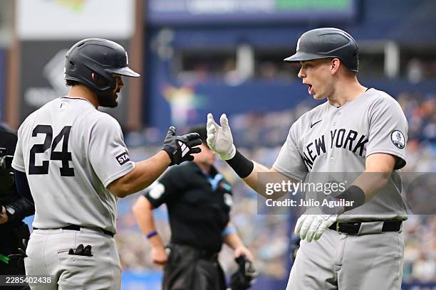 Ben Rice celebrates with Jasson Domínguez of the New York Yankees after hitting a three-run home run in the sixth inning against the Tampa Bay Rays...