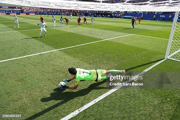 Yassine Bounou of Morocco saves a penalty by Kylian Mbappe of France during the FIFA World Cup 2026 Quarter Final match between France and Morocco at...