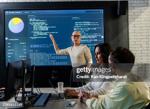 Developer Explaining Software Implementation and Reviewing Coding Workflow During a Team Collaboration Session. Developer Explaining Software Implementation and Reviewing Coding Workflow During a Team Collaboration Session.