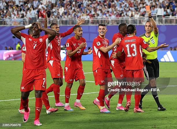 Referee Joao Pinheiro shows a red card to Breel Embolo of Switzerland during the FIFA World Cup 2026 Quarter Final match between Argentina and...