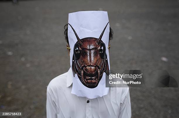 Demonstrator wearing a cockroach mask during a protest organized by the Cockroach Janta Party in Mumbai, India, on July 16, 2026.