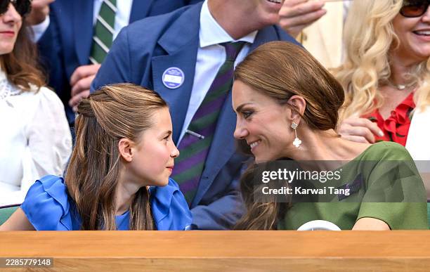 Princess Charlotte of Wales and Catherine, Princess of Wales speak as they attend day fourteen of the 2026 Wimbledon Tennis Championships at the All...