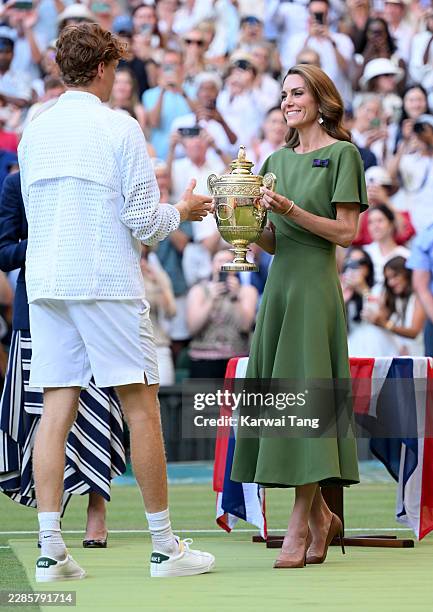 Catherine, Princess of Wales presents the trophy to Jannik Sinner as she attends day fourteen of the 2026 Wimbledon Tennis Championships at the All...