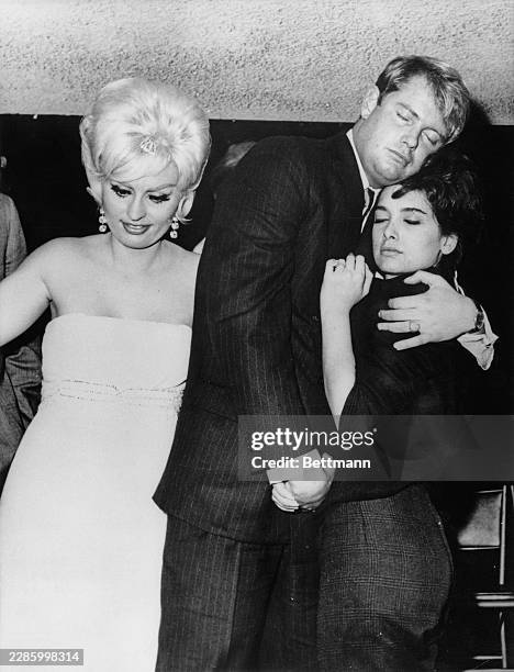 American actors Troy Donahue and Suzanne Pleshette embracing at the Interlude nightclub in Los Angeles, California, December 22nd 1963. According to...