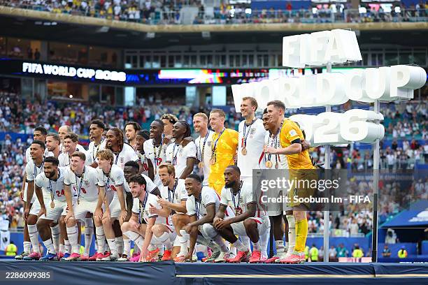 The England national team receive their third place medal after the FIFA World Cup 2026 Bronze Final between France and England at Miami Stadium on...