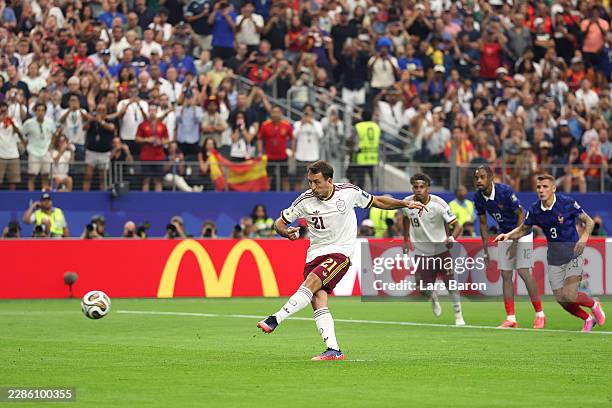 Mikel Oyarzabal of Spain converts a penalty to score his team's first goal during the FIFA World Cup 2026 Semi Final match between France and Spain...