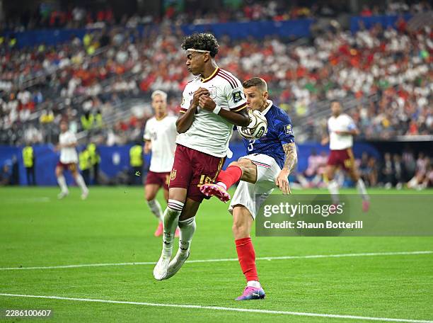 Lamine Yamal of Spain is fouled in the box by Lucas Digne of France during the FIFA World Cup 2026 Semi Final match between France and Spain at...