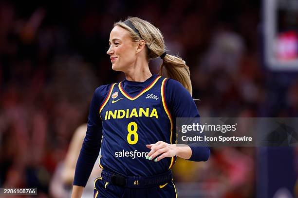 Indiana Fever guard Sophie Cunningham is all smiles after knocking down a three pointer in the second half of play during a WNBA game between the New...