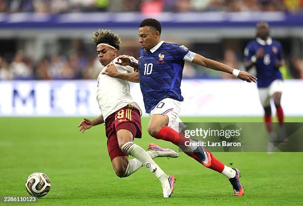 Kylian Mbappe of France competes for the ball against Lamine Yamal of Spain during the FIFA World Cup 2026 Semi Final match between France and Spain...