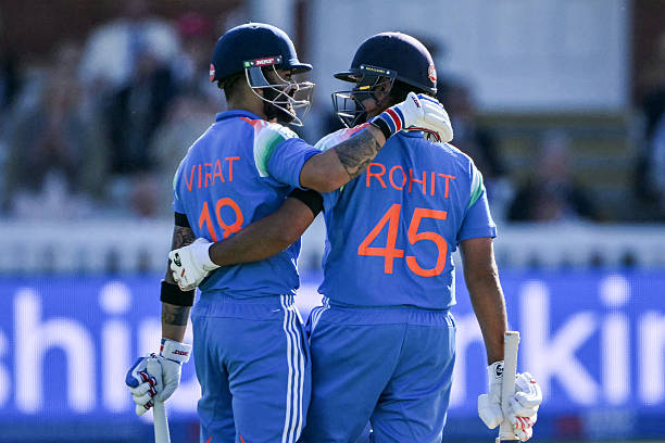 India's Virat Kohli congratulates India's Rohit Sharma as they celebrate his century during the third one-day international cricket match between...