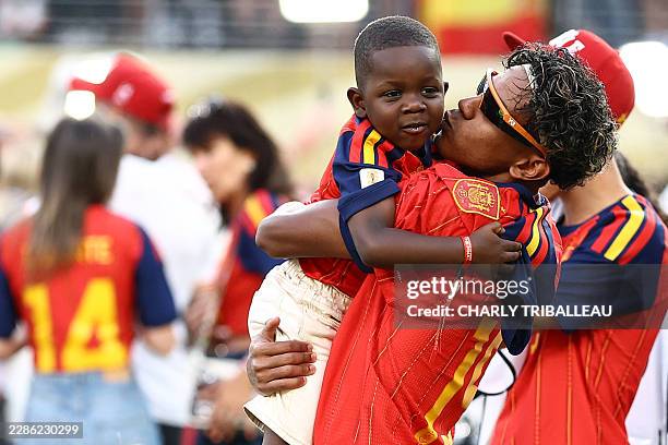 Spain's forward Lamine Yamal celebrates with his brother Keyne after winning the 2026 World Cup football tournament final match between Spain and...