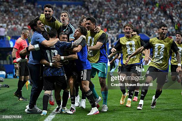 Lautaro Martinez of Argentina celebrates with teammates after scoring the team's second goal during the FIFA World Cup 2026 Semi Final match between...