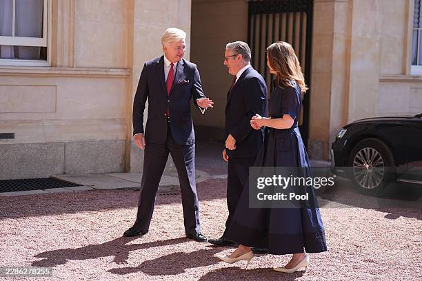 Sir Clive Alderton , Principal Private Secretary to the King and Queen greets outgoing Prime Minister Sir Keir Starmer and his wife Lady Victoria...