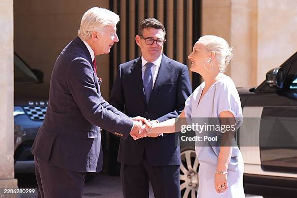 Sir Clive Alderton , Principal Private Secretary to the King greets Labour Party leader Andy Burnham and his wife Marie-France van Heel, as he...