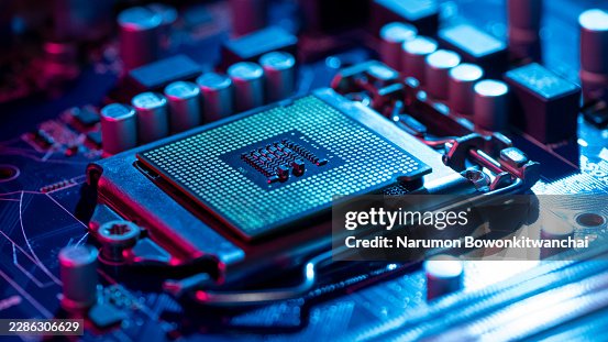 Computer microchip CPU installed in motherboard socket. Computer microchip CPU installed in motherboard socket.