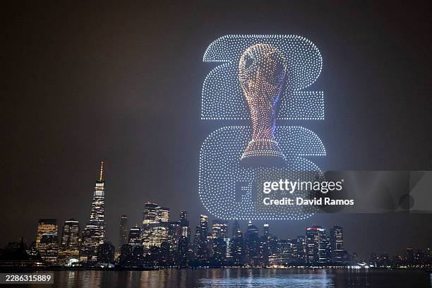 World Cup Trophy visual is displayed against the Manhattan skyline during the FIFA Drone show in New York/New Jersey at Liberty State Park on July...