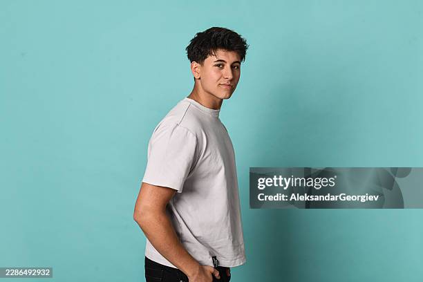 handsome teen student portrait with white shirt and confident look - medium shot stock pictures, royalty-free photos & images