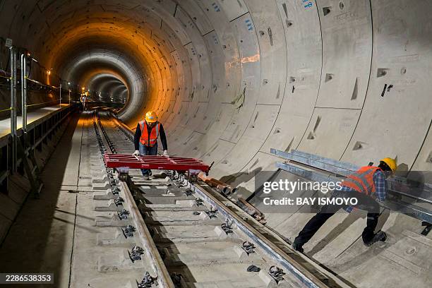 Construction workers complete their work in the phase 2 MRT underground tunnel in Jakarta on July 22, 2026.