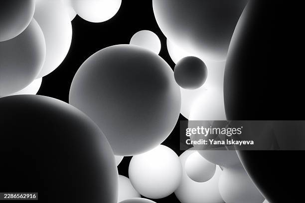 monochrome spheres floating in dark space symbolizing collective intelligence - cytokine stock pictures, royalty-free photos & images