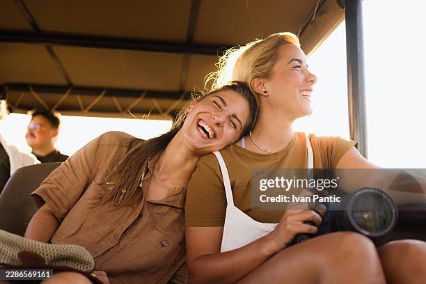 happy young women enjoying safari adventure - namibia stock pictures, royalty-free photos & images