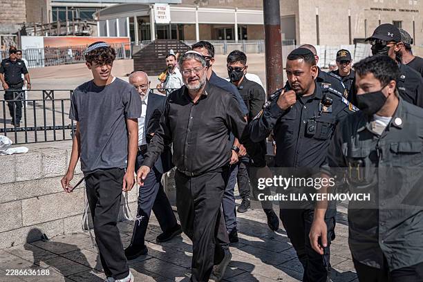 Israel's far-right National Security Minister Itamar Ben Gvir enters Al-Aqsa Mosque compound during the day of Tisha B'Av commemorating the...
