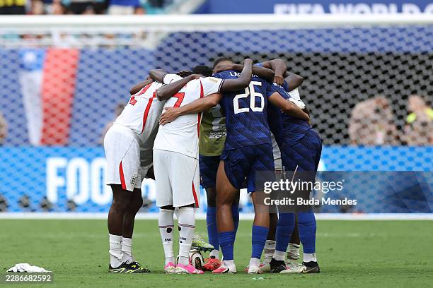 England and France players huddle after the FIFA World Cup 2026 Bronze Final between France and England at Miami Stadium on July 18, 2026 in Miami...