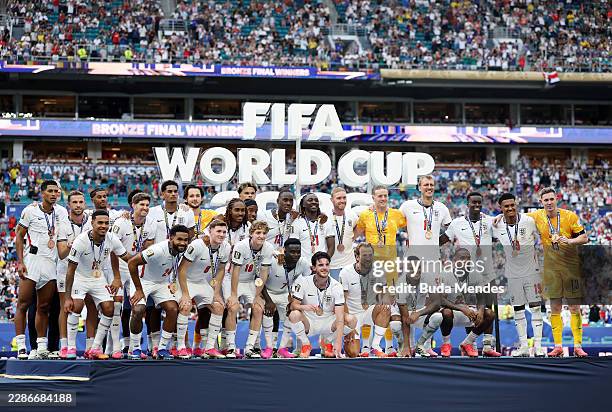 England players pose for a photograph after receiving their third place medals after their 6-4 win during the FIFA World Cup 2026 Bronze Final...