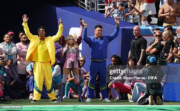 Ronaldinho, Madonna and Ronaldo perform during the Topps Final Halftime Show in the FIFA World Cup 2026 Final match between Spain and Argentina at...
