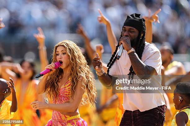 Shakira and Burna Boy perform during the Topps Final Halftime Show the FIFA World Cup 2026 Final match between Spain and Argentina at New York New...