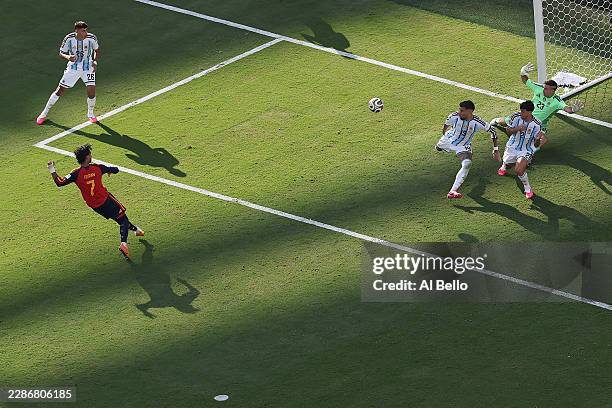 Ferran Torres of Spain scores his team's first goal past Emiliano Martinez of Argentina during the FIFA World Cup 2026 Final match between Spain and...