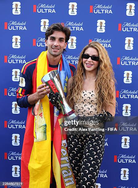 Ferran Torres of Spain poses with the Michelob Ultra Superior Player of the Match Trophy alongside Shakira during the FIFA World Cup 2026 Final match...