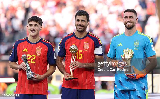Pau Cubarsi, Rodri and Unai Simon of Spain pose with their awards after the FIFA World Cup 2026 Final match between Spain and Argentina at New York...