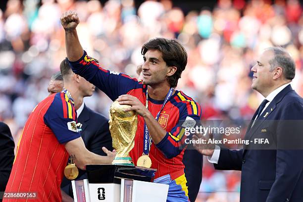 Ferran Torres of Spain celebrates with the FIFA World Cup Winner's Trophy after receiving his medal during the FIFA World Cup 2026 Final match...